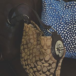 Coach purse tan and brown in very good conditions cleaning closet